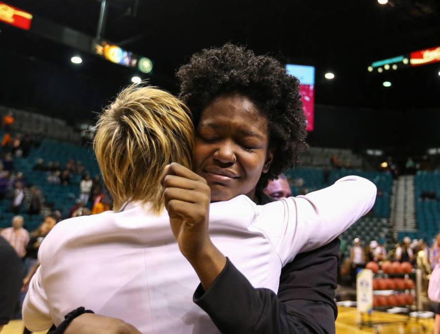 Stanford Cardinal forward Nadia Fingall (4) hugs Associate Head Coach Kate Paye during the second half of an NCAA college basketball game at the Pac-12 women's tournament at the MGM Grand Garden A ...