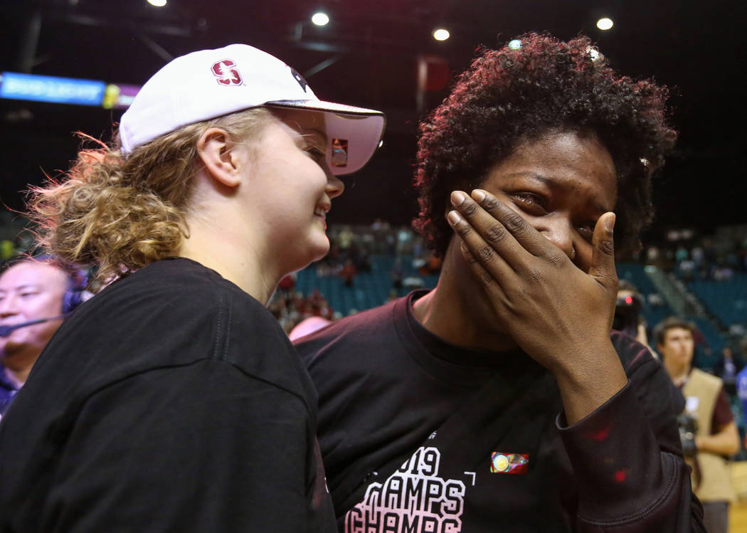 Stanford Cardinal forward Nadia Fingall (4), right, cries while hugging Stanford Cardinal forward Alyssa Jerome (10) during the second half of an NCAA college basketball game at the Pac-12 women's ...
