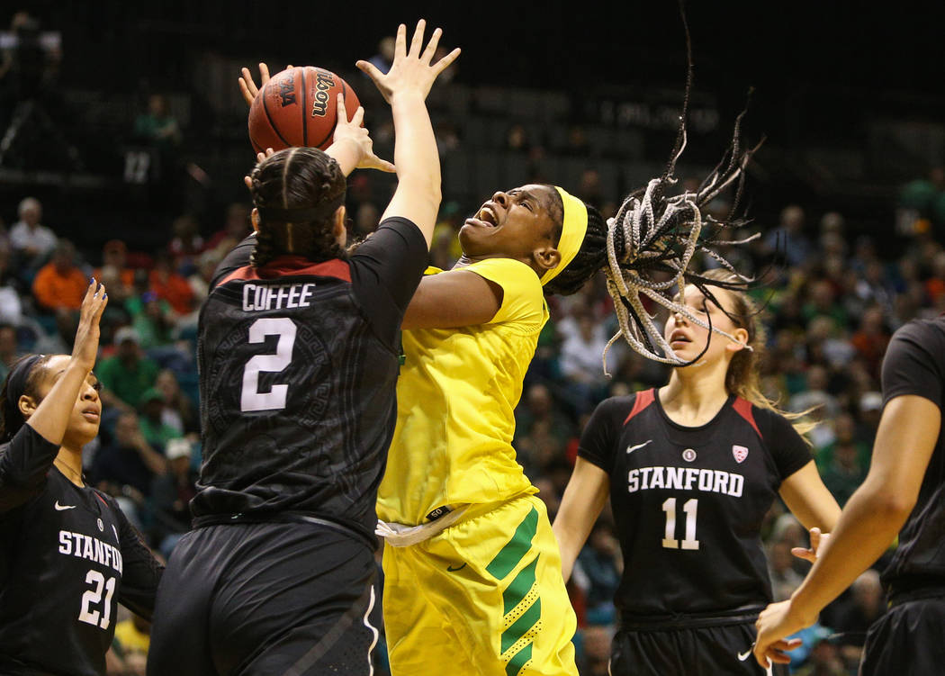 Stanford Cardinal center Shannon Coffee (2) knocks the ball out of the hands of Oregon Ducks forward Ruthy Hebard (24) during the second half of an NCAA college basketball game at the Pac-12 women ...