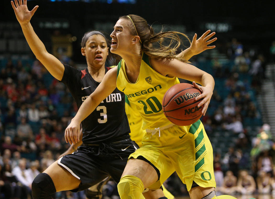 Oregon Ducks guard Sabrina Ionescu (20) looks to pass the ball while being guarded by Stanford Cardinal guard Anna Wilson (3) during the second half of an NCAA college basketball game at the Pac-1 ...