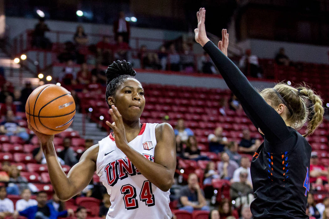 UNLV's Rodjanae Wade (24) looks for a pass while Boise State's Emerald Tooth (44) tries to block at the Thomas & Mack Center in Las Vegas on Saturday, Feb. 3, 2018. UNLV won 77-54. Patrick Connol ...