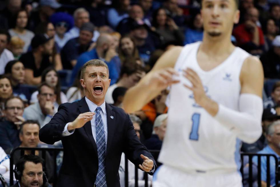 San Diego coach Sam Scholl, left, reacts during the first half of the team's NCAA college basketball game against Gonzaga, Saturday, Feb. 16, 2019, in San Diego. (AP Photo/Gregory Bull)