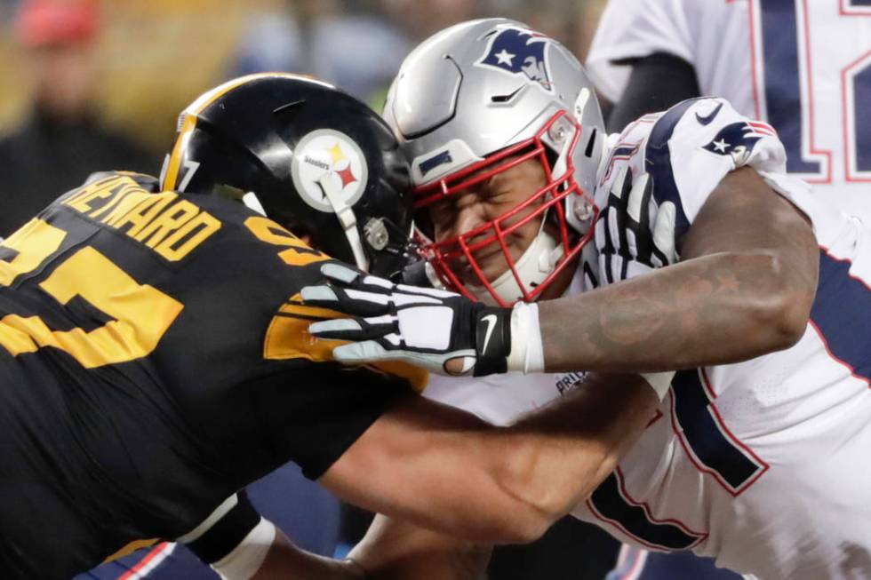 New England Patriots offensive tackle Trent Brown (77) plays against the Pittsburgh Steelers in an NFL football game, Sunday, Dec. 16, 2018, in Pittsburgh. (AP Photo/Don Wright)