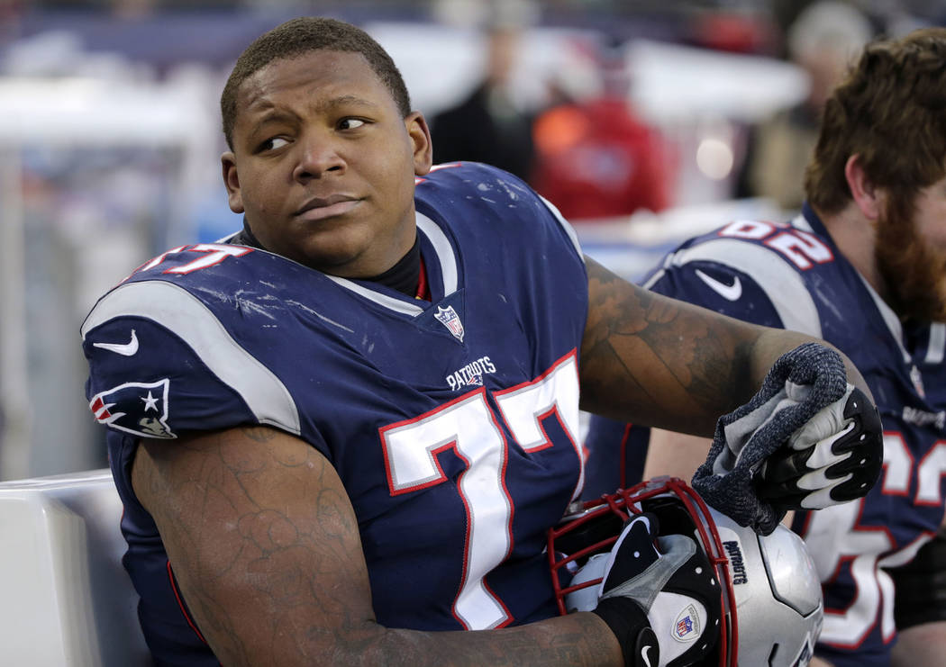 New England Patriots tackle Trent Brown sits on the sideline during the second half of an NFL football game against the Buffalo Bills, Sunday, Dec. 23, 2018, in Foxborough, Mass. (AP Photo/Elise A ...