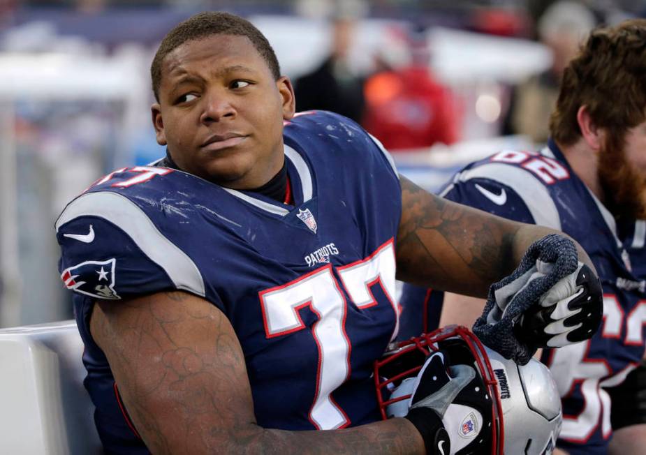 New England Patriots tackle Trent Brown sits on the sideline during the second half of an NFL football game against the Buffalo Bills, Sunday, Dec. 23, 2018, in Foxborough, Mass. (AP Photo/Elise A ...