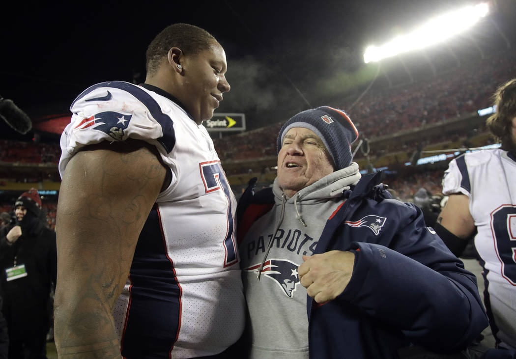 New England Patriots offensive tackle Trent Brown (77) celebrates with head coach Bill Belichick after defeating the Kansas City Chiefs in the AFC Championship NFL football game, Sunday, Jan. 20, ...