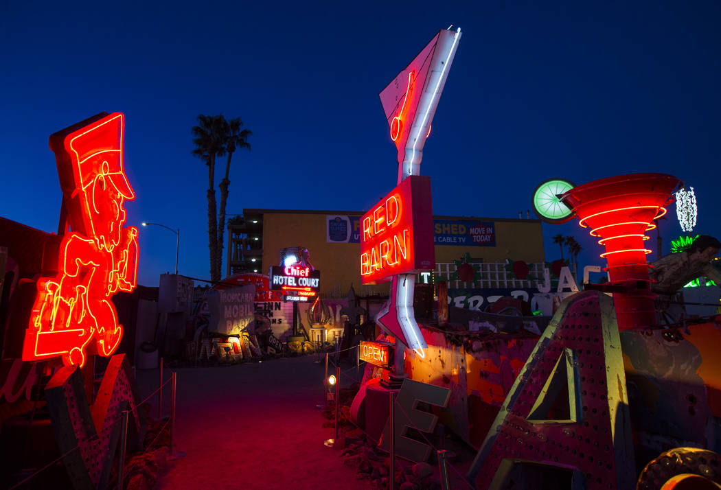 Neon signs light up the boneyard at the Neon Museum at dawn in Las Vegas on Monday, Jan. 28, 2019. (Chase Stevens/Las Vegas Review-Journal) @csstevensphoto