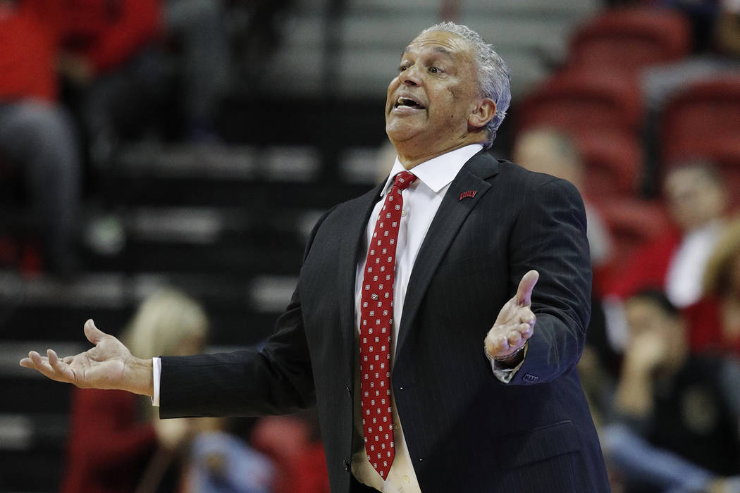 UNLV coach Marvin Menzies gestures during the second half of the team's NCAA college basketball game against Nevada on Tuesday, Jan. 29, 2019, in Las Vegas. Nevada won 87-70. (AP Photo/John Locher)