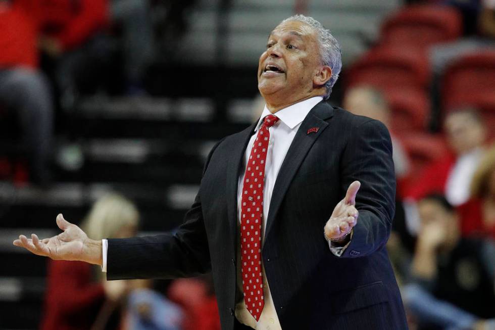 UNLV coach Marvin Menzies gestures during the second half of the team's NCAA college basketball game against Nevada on Tuesday, Jan. 29, 2019, in Las Vegas. Nevada won 87-70. (AP Photo/John Locher)