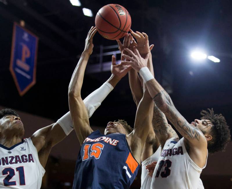 Gonzaga junior forward Rui Hachimura (21) and senior guard Josh Perkins (13) fight for a loose ball with Pepperdine freshman forward Kessler Edwards (15) in the second half during the West Coast C ...