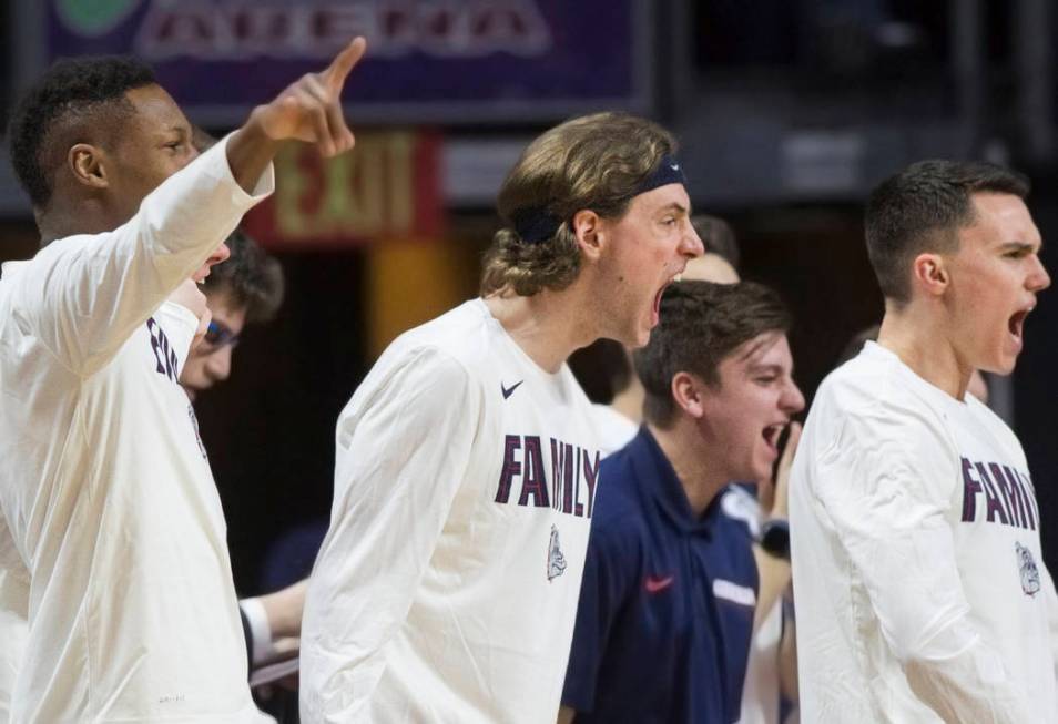 The Gonzaga bench erupts after a dunk in the second half during their West Coast Conference semifinal game with Pepperdine on Monday, March 11, 2019, at Orleans Arena, in Las Vegas. The Bulldogs b ...