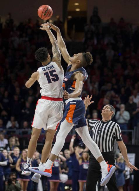 Gonzaga junior forward Brandon Clarke (15) leaps for the opening tip with Pepperdine freshman center Victor Ohia Obioha (34) in the first half during the West Coast Conference semifinal game on Mo ...