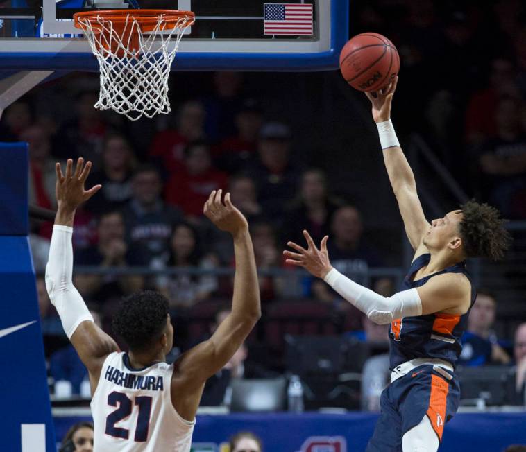 Pepperdine sophomore guard Colbey Ross (4) slices to the rim past Gonzaga junior forward Rui Hachimura (21) in the first half during the West Coast Conference semifinal game on Monday, March 11, 2 ...