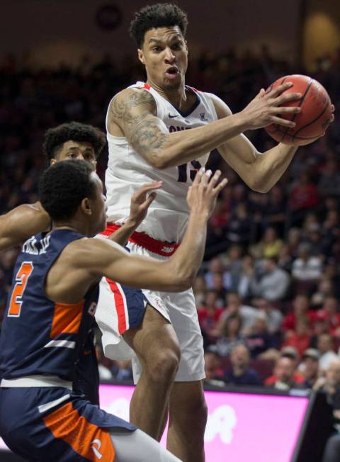 Gonzaga junior forward Brandon Clarke (15) grabs a rebound over Pepperdine freshman guard Darryl Polk Jr. (2) in the first half during the West Coast Conference semifinal game on Monday, March 11, ...