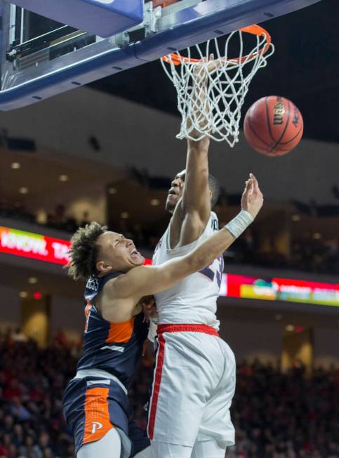 Pepperdine sophomore guard Colbey Ross (4) gets fouled by Gonzaga sophomore guard Zach Norvell Jr. (23) in the second half during the West Coast Conference semifinal game on Monday, March 11, 2019 ...