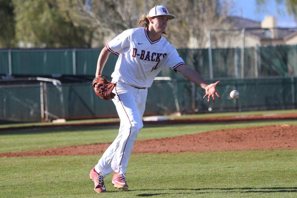 Desert Oasis' Josh Sharman (11) throws the ball to first base for an out against Palo Verde in the baseball game at Desert Oasis High School in Las Vegas, Tuesday, March 12, 2019. Erik Verduzco La ...