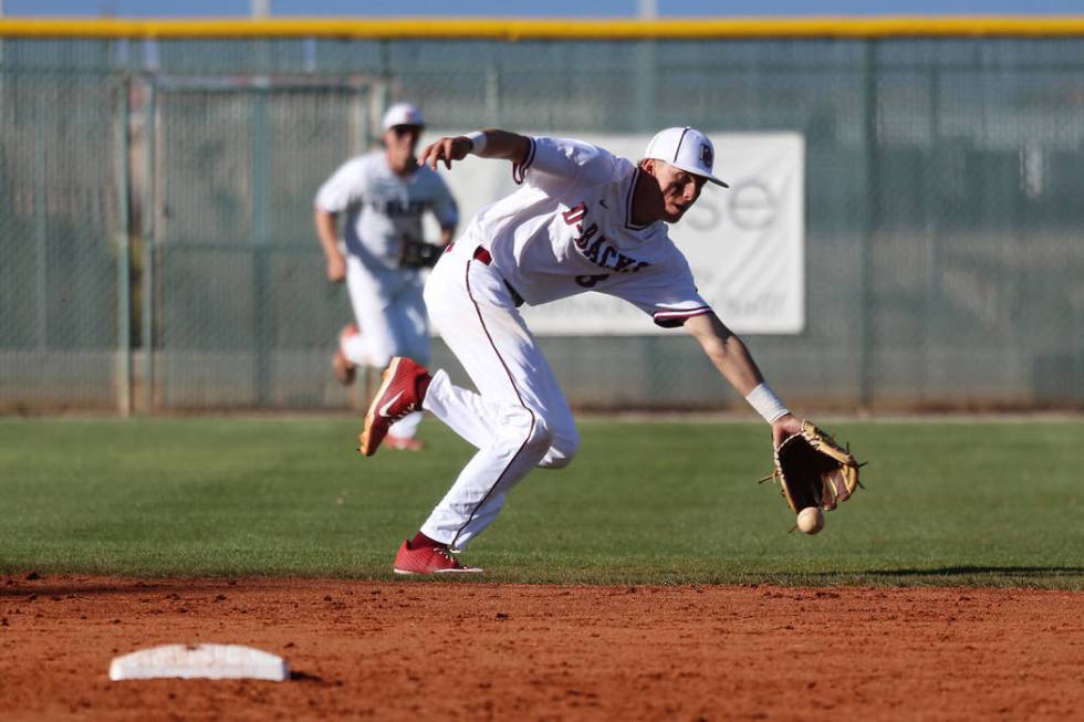 Desert Oasis' Zac Czerniawski (8) reaches short for the ball to allow a hit against Palo Verde in the baseball game at Desert Oasis High School in Las Vegas, Tuesday, March 12, 2019. Erik Verduzco ...