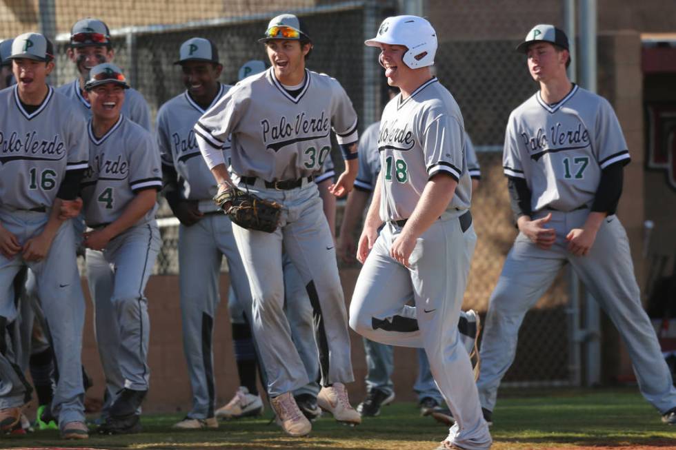 Palo Verde's Hunter Chynoweth (18), center, runs home for a run after hitting a homer against Desert Oasis in the baseball game at Desert Oasis High School in Las Vegas, Tuesday, March 12, 2019. E ...