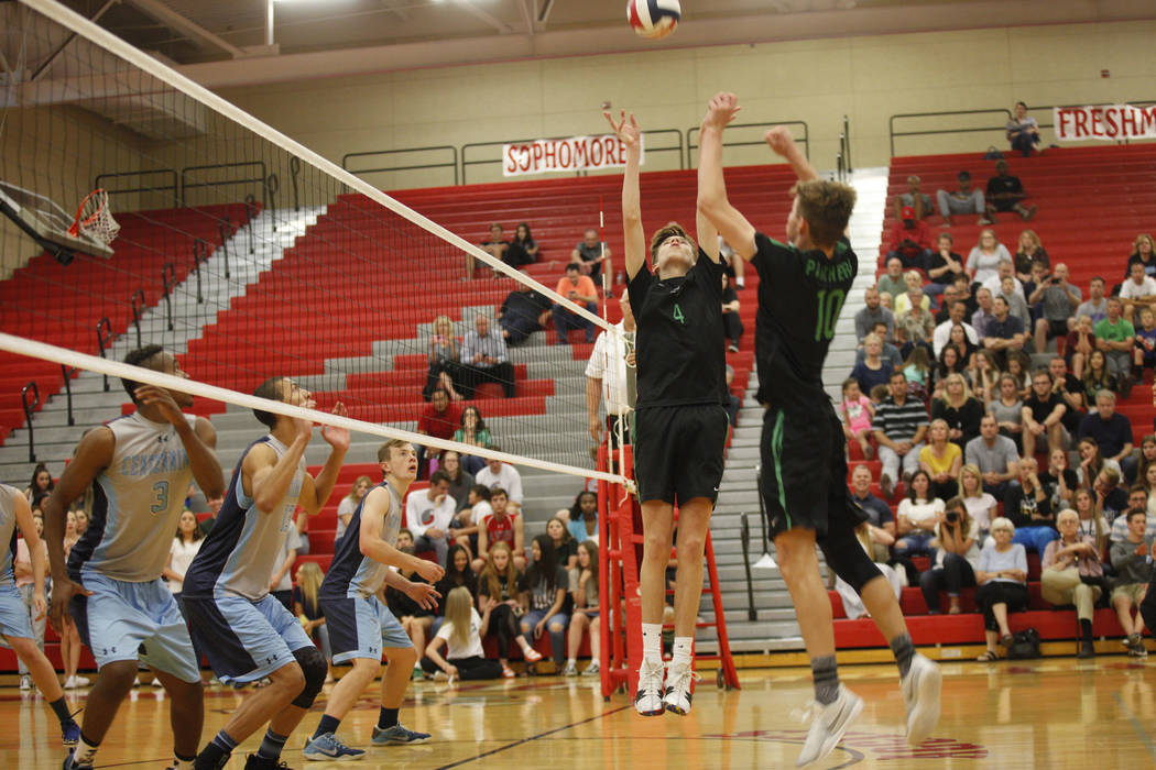 Palo Verde High School's Jared Brady (10) preps the ball for teammate Cooper Jarman (4) to spike it in the Sunset Region boys semifinal against Centennial High School at Arbor View High School in ...