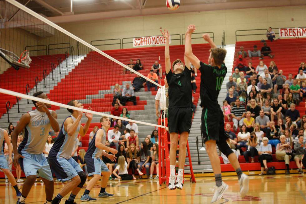 Palo Verde High School's Jared Brady (10) preps the ball for teammate Cooper Jarman (4) to spike it in the Sunset Region boys semifinal against Centennial High School at Arbor View High School in ...