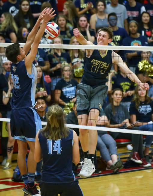 Centennial's Austin Anderson (12) blocks a shot from Foothill's Caleb Stearman (10) during the third set of the Class 4A state volleyball championship match at Arbor View High School in Las Vegas ...