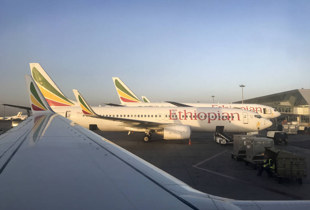 This photo taken Monday, Feb. 11, 2019 shows an Ethiopian Airlines Boeing 737-800 parked at Bole International Airport in Addis Ababa, Ethiopia. An Ethiopian Airlines Boeing 737 Max 8 jetliner car ...