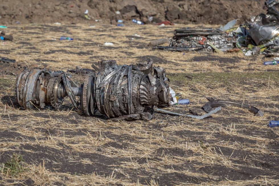 Airplane parts lie on the ground at the scene of an Ethiopian Airlines flight crash near Bishoftu, or Debre Zeit, south of Addis Ababa, Ethiopia, Monday, March 11, 2019. A spokesman says Ethiopia ...