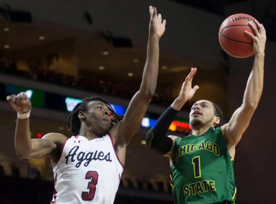 Chicago State senior guard Rob Shaw (1) slices to the rim past New Mexico State junior guard Terrell Brown (3) in the first half of the opening round of the Western Athletic Conference tournament ...