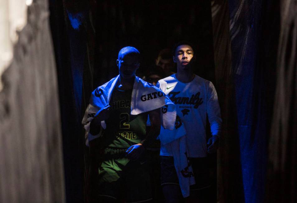 Chicago State senior guard Delshon Strickland (2) and sophomore forward Cameron Bowles (21) walk out of the locker room at the start of the second half of their opening round Western Athletic Con ...