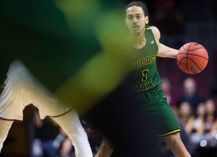 Chicago State senior guard Rob Shaw (1) surveys the court in the first half during the Cougars opening round Western Athletic Conference tournament game with New Mexico State on Thursday, March 14 ...