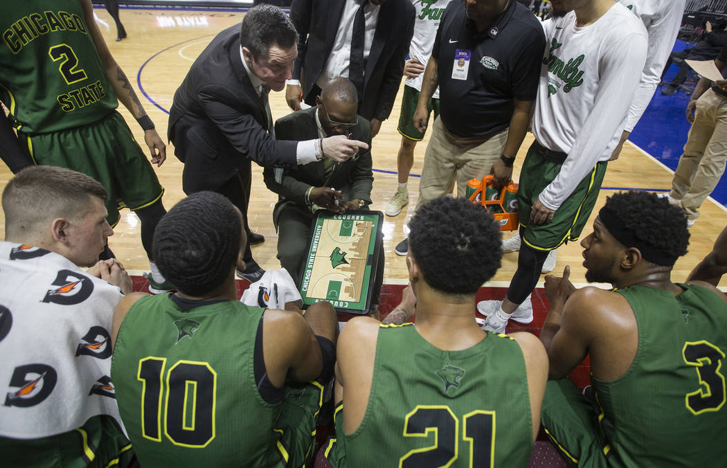 Chicago State gets coached up during a timeout in the second half during the Cougars opening round Western Athletic Conference tournament game with New Mexico State on Thursday, March 14, 2019, at ...