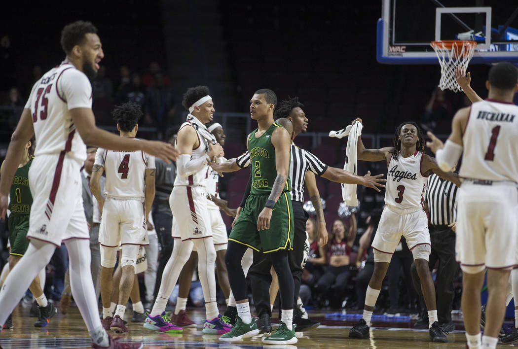 New Mexico State celebrates a big play as Chicago State senior guard Delshon Strickland (2) walks to the bench in the second half of the opening round of the Western Athletic Conference tournament ...