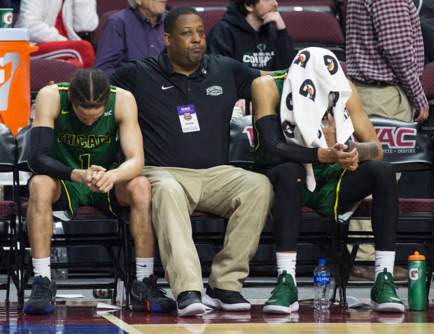 Chicago State senior guard Rob Shaw, left, and Chicago State senior guard Delshon Strickland, right, sit dejected on the bench as time winds down on a 86-49 loss to New Mexico State in the opening ...