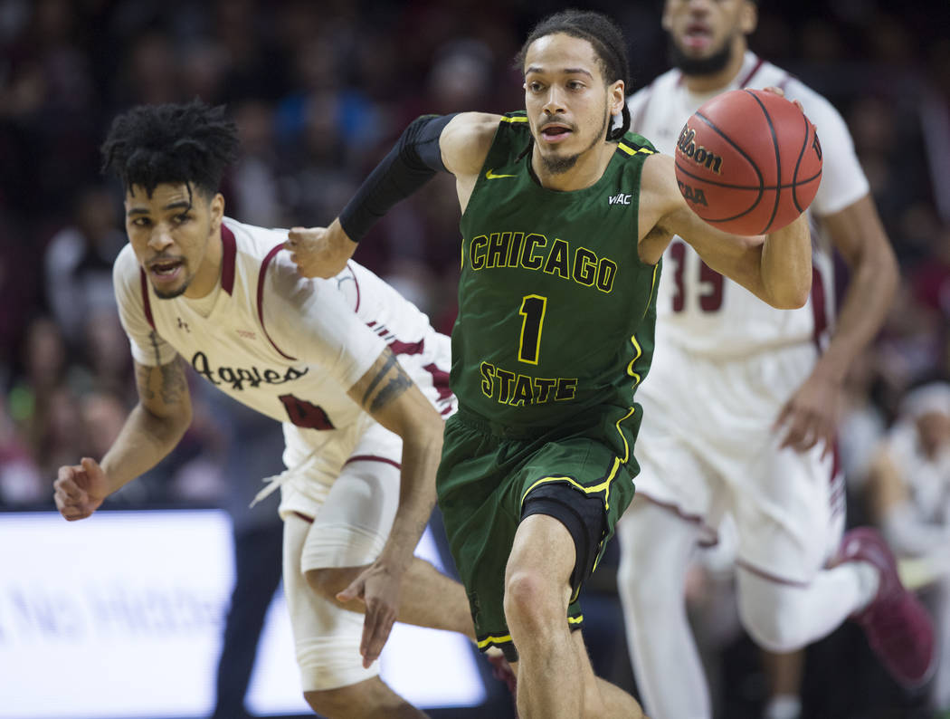 Chicago State senior guard Rob Shaw (1) pushes the ball up court past New Mexico State senior guard JoJo Zamora (4) in the second half of the opening round of the Western Athletic Conference tourn ...