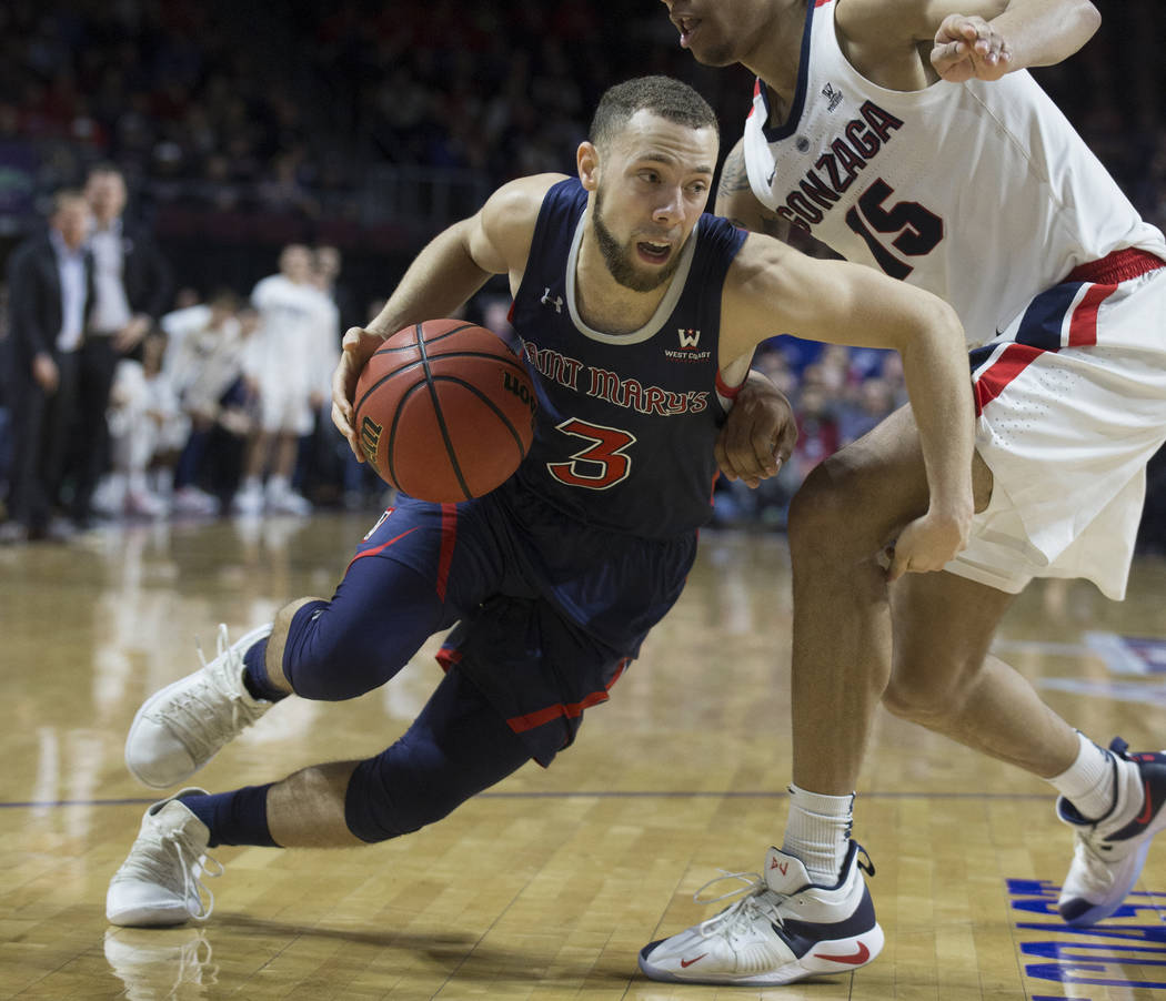 St. Mary's junior guard Jordan Ford (3) drives past Gonzaga junior forward Brandon Clarke (15) in the second half during the West Coast Conference finals game on Tuesday, March 12, 2019, at Orlean ...