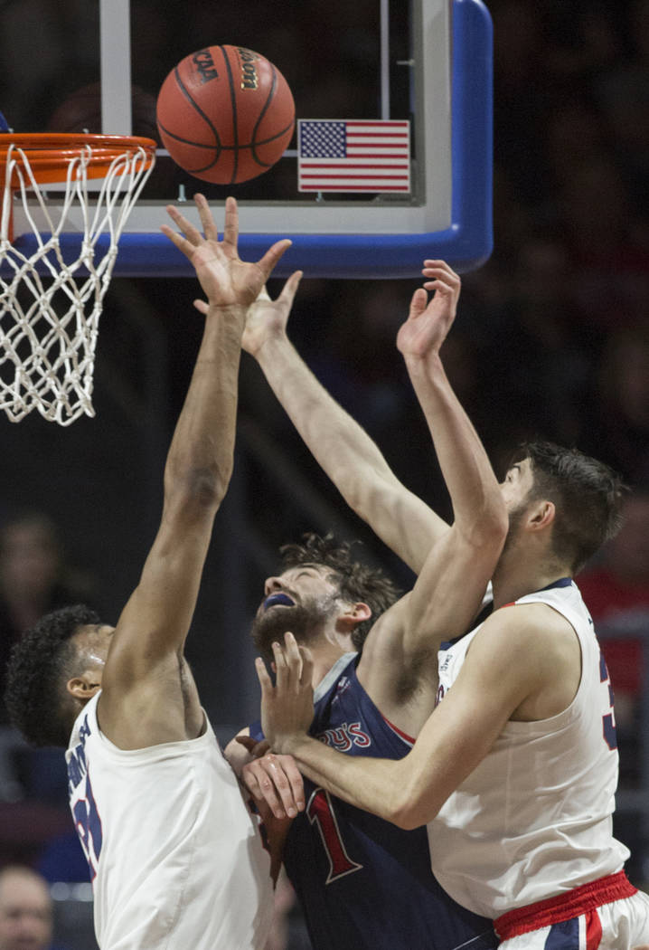 St. Mary's senior center Jordan Hunter (1) fights for a rebound with Gonzaga junior forward Killian Tillie (33) and junior forward Rui Hachimura (21) in the first half during the West Coast Confer ...