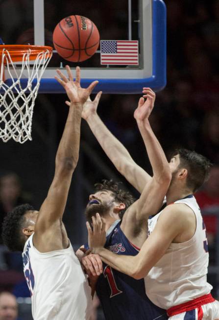 St. Mary's senior center Jordan Hunter (1) fights for a rebound with Gonzaga junior forward Killian Tillie (33) and junior forward Rui Hachimura (21) in the first half during the West Coast Confer ...