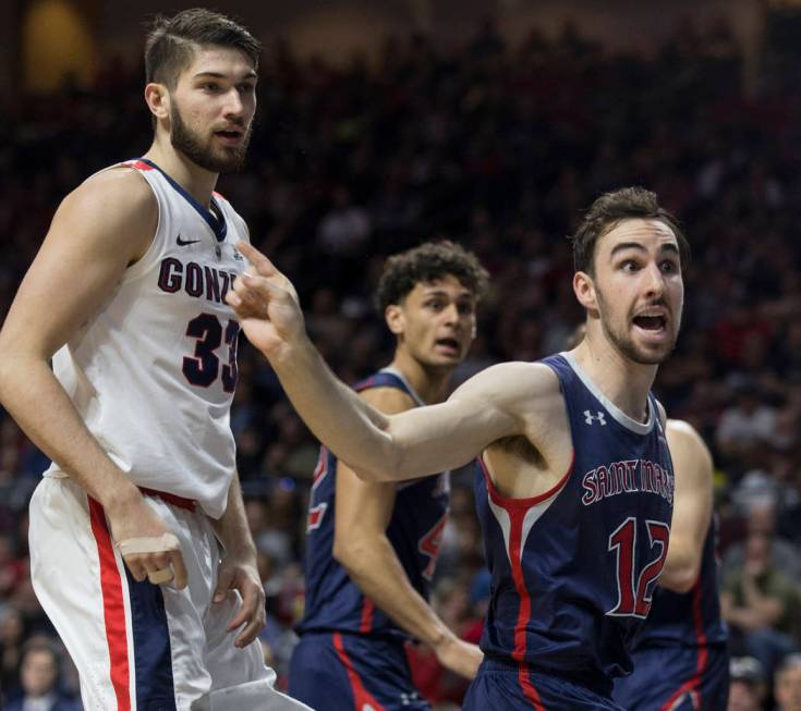 St. Mary's sophomore guard Tommy Kuhse (12) lobbies for a call as Gonzaga junior forward Killian Tillie (33) looks on in the second half during the West Coast Conference finals game on Tuesday, M ...