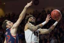 Gonzaga senior guard Josh Perkins (13) slices to the rim past St. Mary's sophomore guard Tommy Kuhse (12) in the first half during the West Coast Conference finals game on Tuesday, March 12, 2019, ...