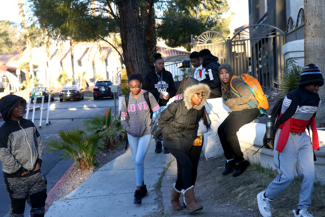 Students brace from the wind and cold while making their way to the school bus at Desert Shores Villas in Las Vegas Wednesday, March 13, 2019. (K.M. Cannon/Las Vegas Review-Journal) @KMCannonPhoto