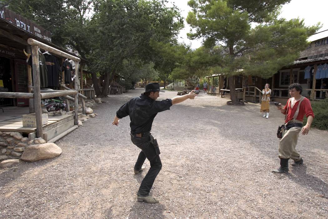 Gunfighters Presley "Last Chance Vance" Conkle, left, and Kendall "Hollywood Cowboy" Zobrist put on a show a Bonnie Springs Old Nevada old West town theme park in Red Rock Canyon, July 20, 2005. O ...