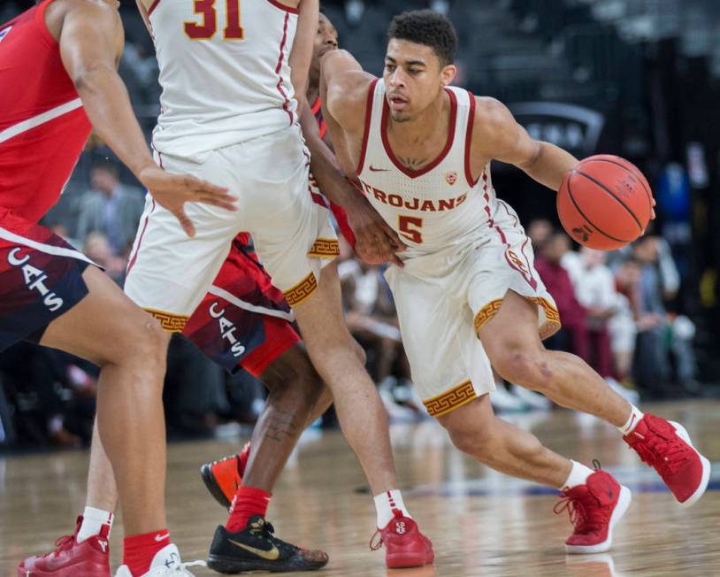 USC junior guard Derryck Thornton (5), a Findlay Prep graduate, turns the corner past an Arizona defender in the first half during the Pac-12 tournament on Wednesday, March 13, 2019, at T-Mobile A ...