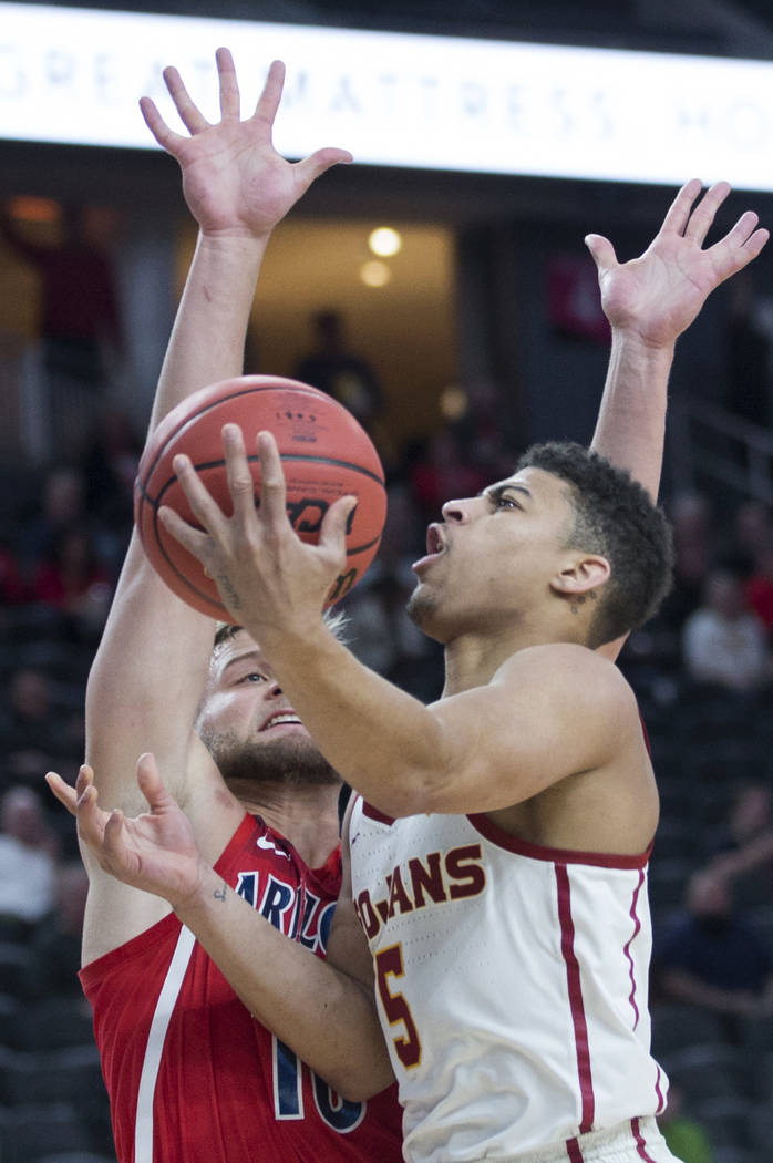 USC junior guard Derryck Thornton (5), a Findlay Prep graduate, slices to the rim past Arizona senior forward Ryan Luther (10) in the first half during the Pac-12 tournament on Wednesday, March 13 ...