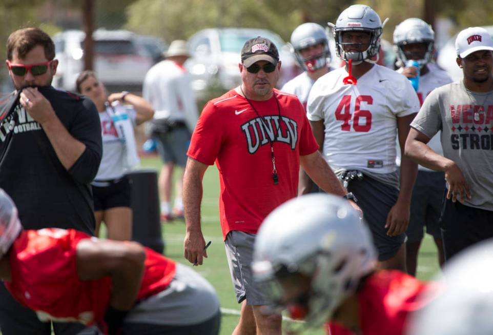UNLV football coach Tony Sanchez watches over his players as they runs through drills during team practice at UNLV's Rebel Park in Las Vegas on Monday, Aug. 20, 2018. Richard Brian Las Vegas Revie ...