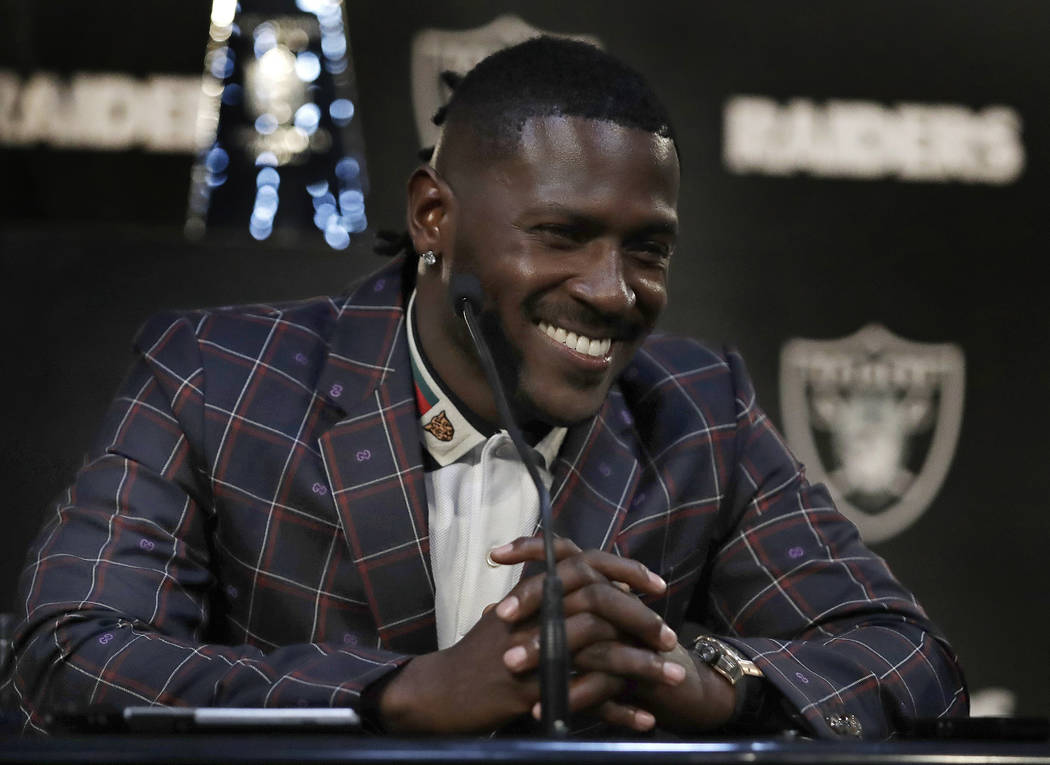 Oakland Raiders wide receiver Antonio Brown smiles during an NFL football news conference, Wednesday, March 13, 2019, in Alameda, Calif. (AP Photo/Ben Margot)