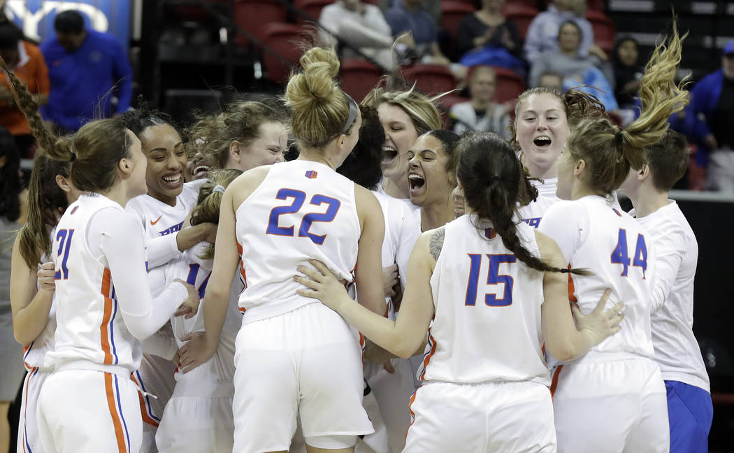 Boise State players celebrate after defeating Wyoming68-51 in an NCAA college basketball game for the Mountain West Conference women's tournament championship Wednesday, March 13, 2019, in Las Veg ...