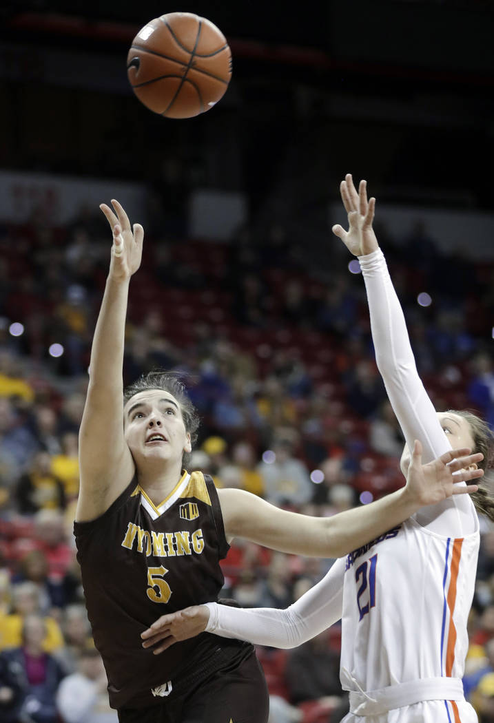 Boise State's Riley Lupfer defends as Wyoming's Sladjana Rakovic (5) shoots during the second half of an NCAA college basketball game for the Mountain West Conference women's tournament championsh ...