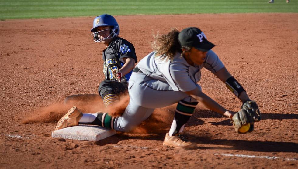 Hola Rosalia Nakayama (37) slides safely into third base as Palo Verde's Maddison Hearn (10) catches the ball in the fourth inning of a softball game against at Palo Verde High School in Las Vegas ...