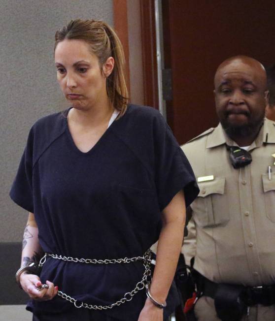 Alexis Plunkett, the jailed Las Vegas defense lawyer, is led into the courthouse during her bail hearing at the Regional Justice Center on Thursday, March. 14, 2019, in Las Vegas. Bizuayehu Tesfay ...