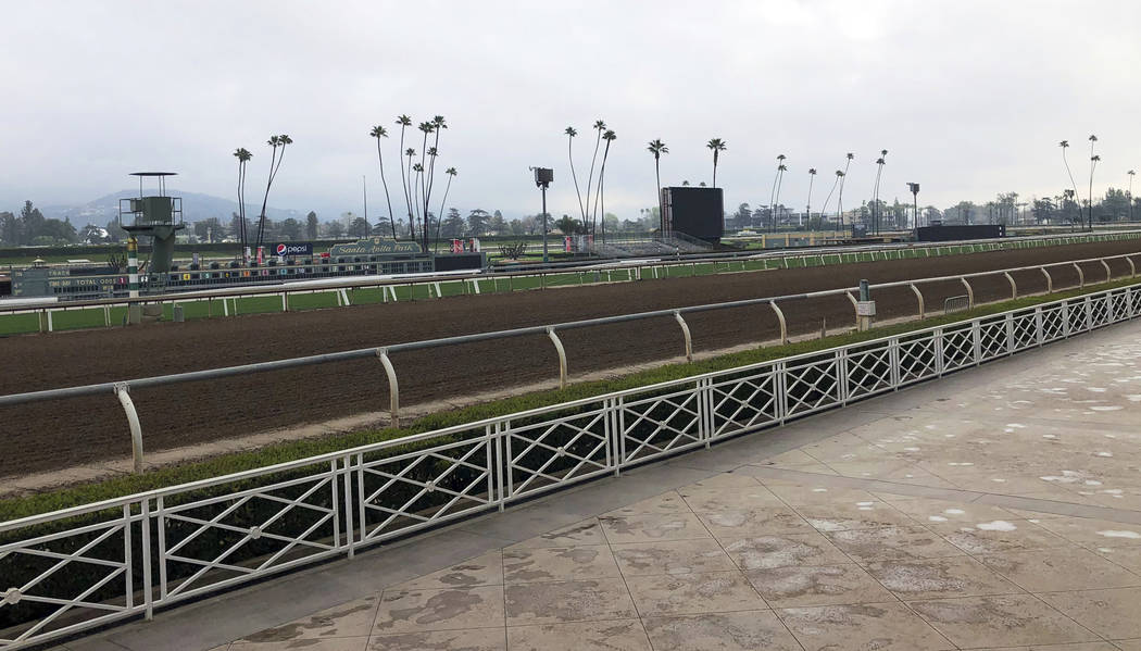 The home stretch and stands are empty at Santa Anita Park in Arcadia, Calif., Thursday, March 7, 2019. Extensive testing of the dirt track is under way at eerily quiet Santa Anita, where the death ...